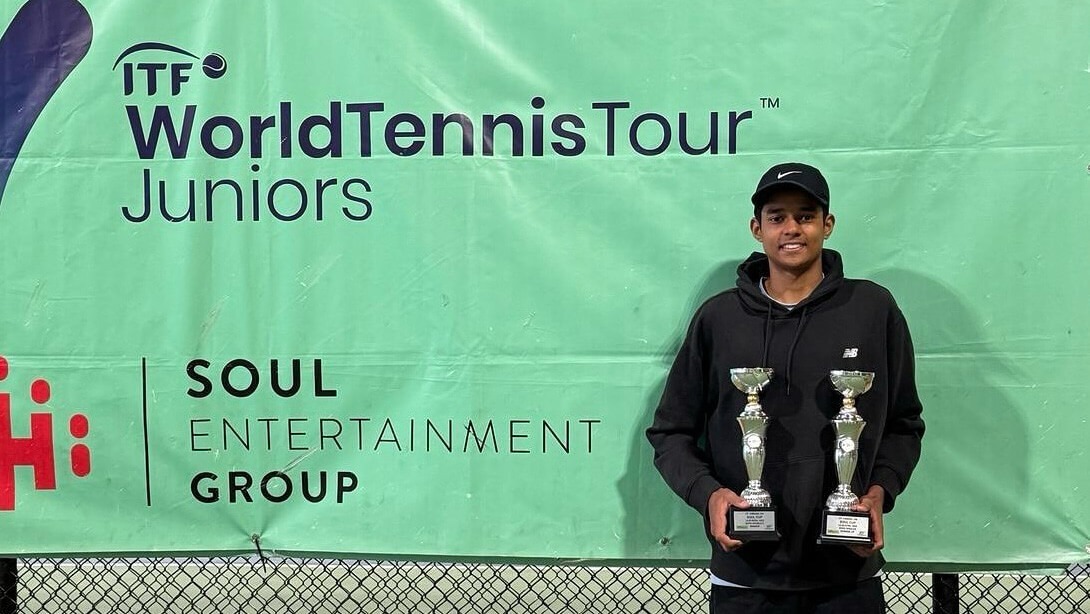 Gautam Venkatraman holding the doubles trophy after ITF J30 Istanbul win