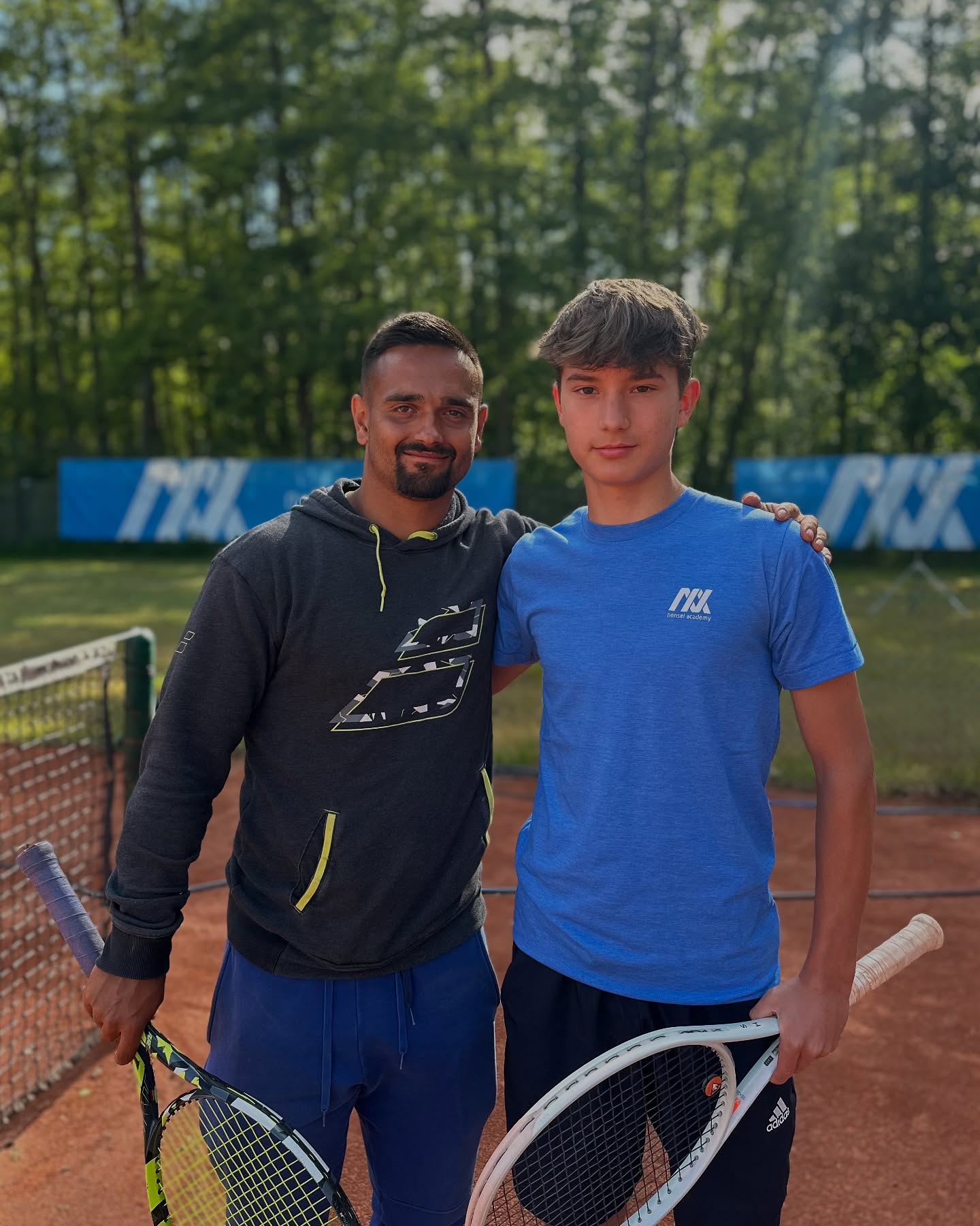 Tom Ott with his coach at nensel tennis academy
